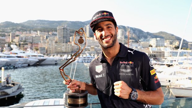A "much happier" Ricciardo with this third-place trophy. 