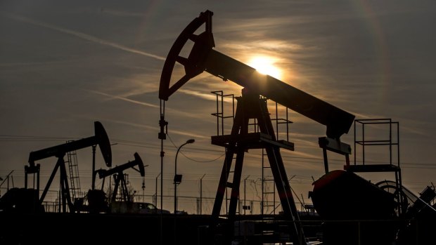 Crude slid to the lowest level in more than six years in New York on Friday after Baker Hughes said the number of active oil rigs in the US climbed.