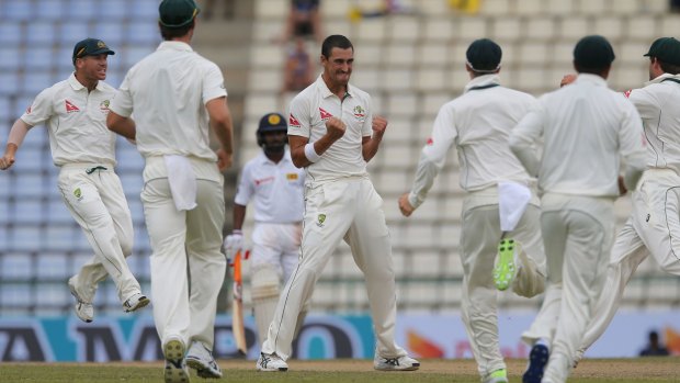 Late strike: Mitchell Starc picked up the wicket of Kusal Perera just before the rain came.