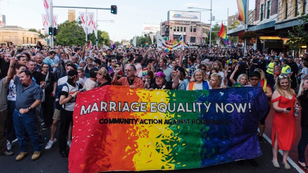 Crowds march down Oxford Street, Darlinghurst, to celebrate the "yes" vote.