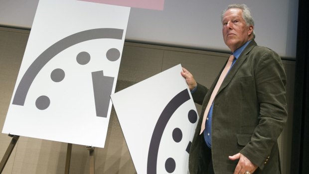 Climate scientist Richard Somerville, a member, Science and Security Board, Bulletin of the Atomic Scientists, unveils the new Doomsday Clock in Washington. 