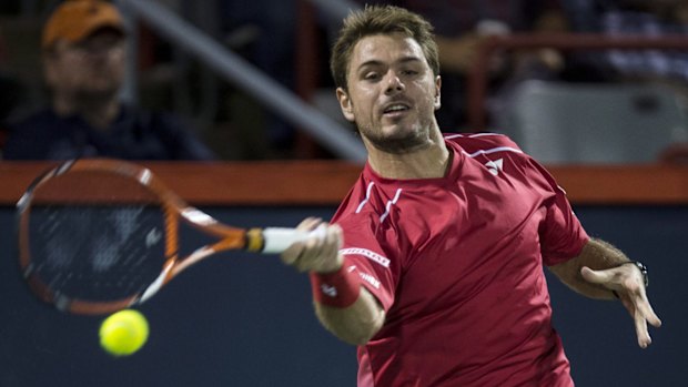 Fiery encounter: Stan Wawrinka returns to Nick Kyrgios at the Rogers Cup.