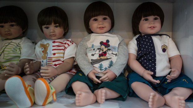 A good luck ''Child Angel'' doll like these has been found in a suitcase in a car park at Chiang Mai airport, stuffed with methamphetamine tablets, Thai authorities say. 