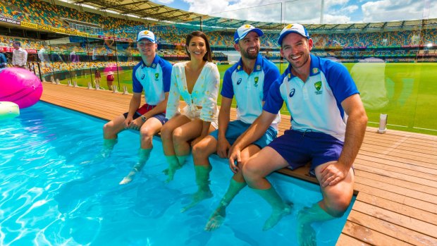In the swim: Jackson Bird, former Olympic swimmer Stephanie Rice, Nathan Lyon and Chadd Sayers pose at the pool deck.