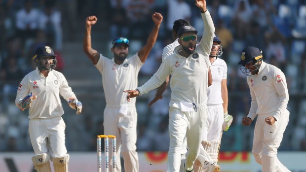 It's a rout: India celebrate the wicket of Jonny Bairstow.