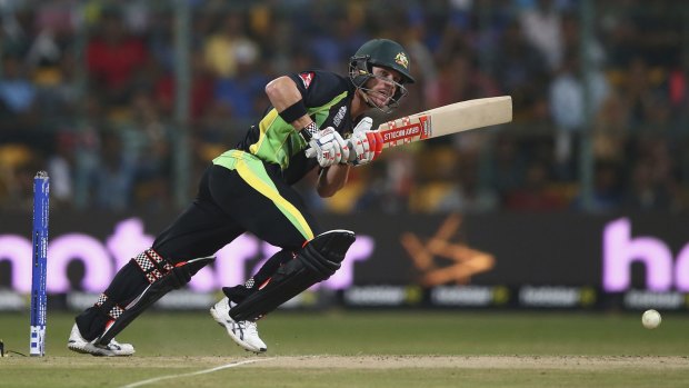 Back foot: David Warner clips a shot through mid-wicket against Bangladesh.