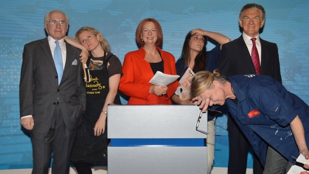 Madam Tussauds Sydney staff Zoe Walton (leaning on John Howard), Crystal Kranz (rear) and Jan Cowell (front). 