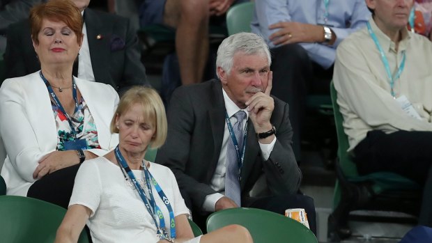 Former AFL coach Mick Malthouse watches from the Presidents' Reserve section of Rod Laver Arena.