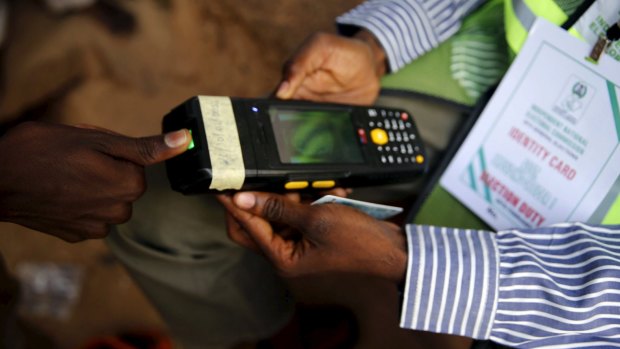 A card reader displays the thumb print of a voter in Daura, north-west Nigeria.