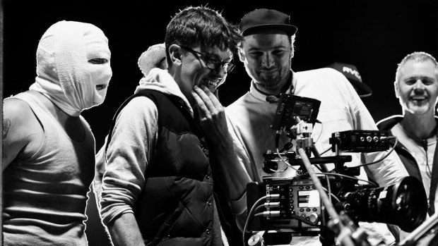 On set  ... Abe Forsythe (second from left) watches a take with actor Justin Rosniak, director of photography Lachlan Milne and stunt co-ordinator Tony Lynch.