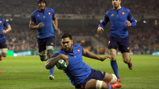 Too little, too late: Romain Taofifenua scores a try for France.