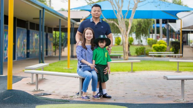 Olivia Chen with her parents Vincent Chen and Kathy Zhang outside her new school.