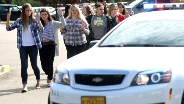 Students and staff are evacuated after a deadly shooting.