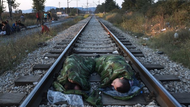 Syrian refugees sleeping on a railroad track near the train station of Idomeni, in northern Greece, this week.