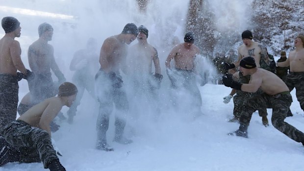 US Marines cover themselves in snow during US and South Korean marines joint winter exercise in Pyeongchang-gun, South Korea this month. 