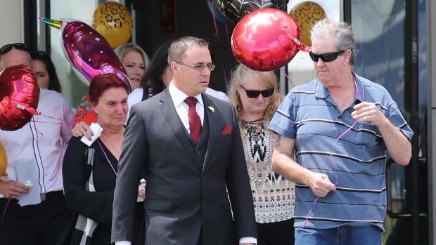 The grief-stricken family of Lauren Brownlee leave her funeral on Friday. 
