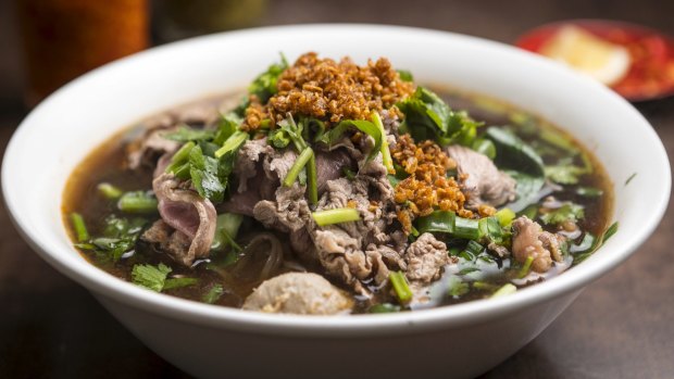Thai noodle soup with sliced beef.