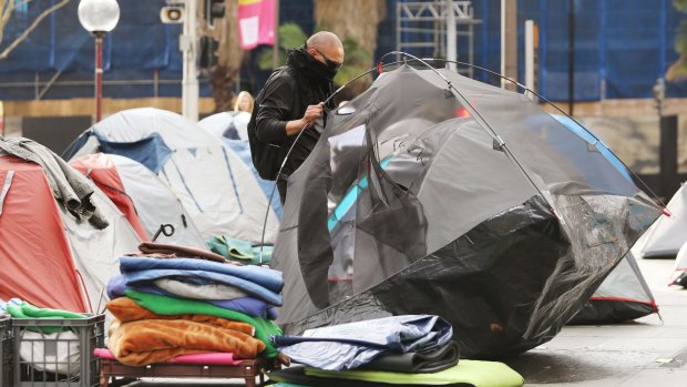 The residents of Martin Place's tent city prepare to move on.