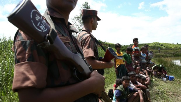 Several hundred Rohingya trying to flee Myanmar got stuck in a "no man's land" at one border point barred from moving farther by Bangladeshi border guards. 