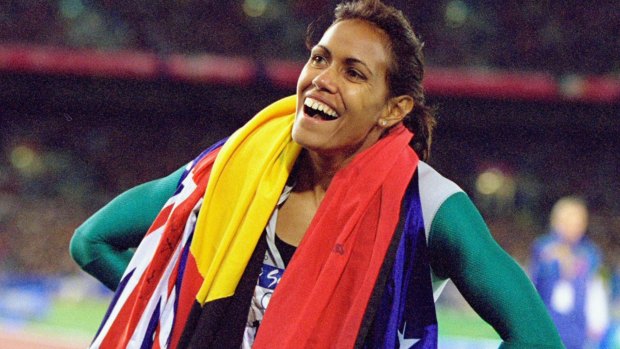 Cathy Freeman celebrates gold in the Womens 400m Final at the Sydney Olympic Stadium.