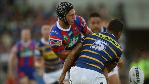 Newcastle's Kalyn Ponga is stopped in his tracks on Saturday night.