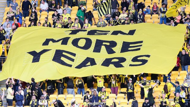 Fighting for their team: Wellington Phoenix supporters hold up a ''Ten More Years'' sign.