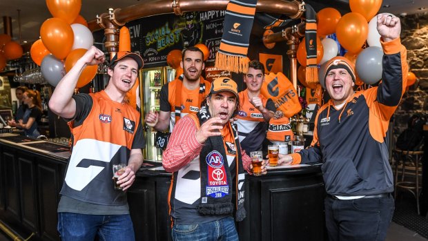Orange people: Melbourne based GWS supporters at Coopers Inn in Exhibition Street which is hosting drinks before Saturday's game: left to right, front, Pat Silk, Lloyd Weser, David Lampert; back: Cameron Butler and Matt Want.