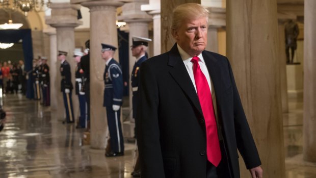 Donald Trump walks through the Crypt at the Capitol in Washington.