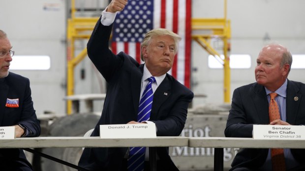 Virginia politicians listen as candidate Donald Trump speaks during a coal mining roundtable in Glade Spring, Virginia.