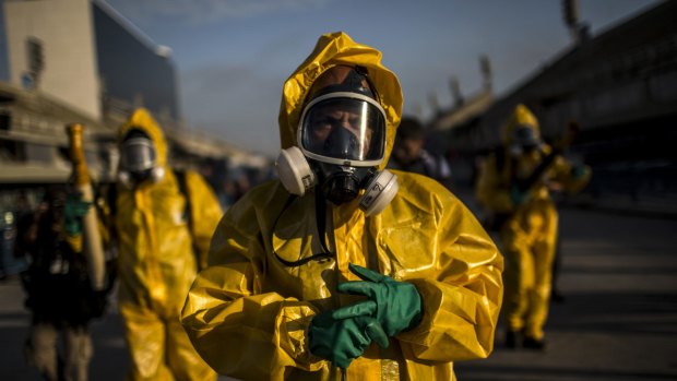 Workers fumigate the Sambadrome ahead of Carnival celebrations in Rio de Janiero. Similar measures would be needed if the virus took hold in Australia.