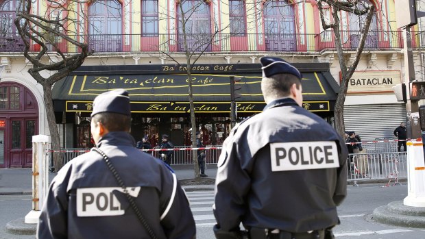 Police officers patrol outside the Bataclan concert hall after the attack.