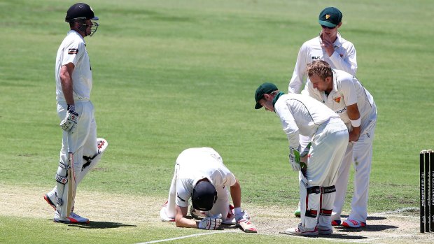 Adam Voges sinks to his knees after being struck in by a bouncer.