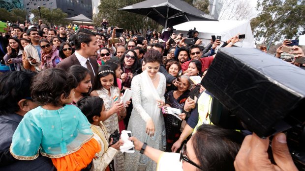 Crowds flock to see Aishwarya Rai Bachchan, who hoisted the Indian national flag ahead of the Independence Day on Tuesday.