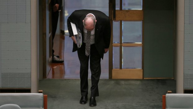 Acting Prime Minister Warren Truss bows as he arrives for question time on Thursday September 10. 