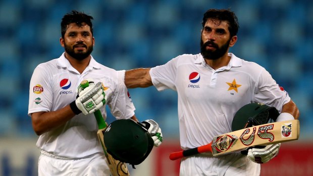 Triple treat: Azhar Ali (left) is congratulated by Misbah-ul-Haq after scoring a triple century against the West Indies in October.