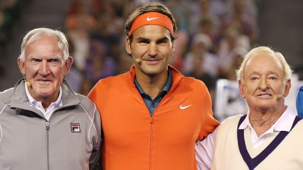 Australian tennis legends Tony Roche (left) and Rod Laver pose with Roger Federer during a charity match at Melbourne Park in 2014.