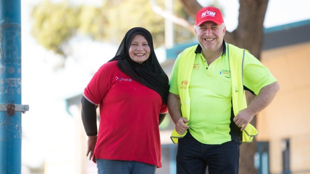Workers Mahani Mohd Tif and Vince Tropea have won better pay and conditions.