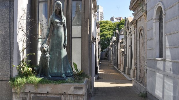 Liliana Crociati de Szaszak memorialised in her wedding dress with her beloved pet dog at La Recoleta.