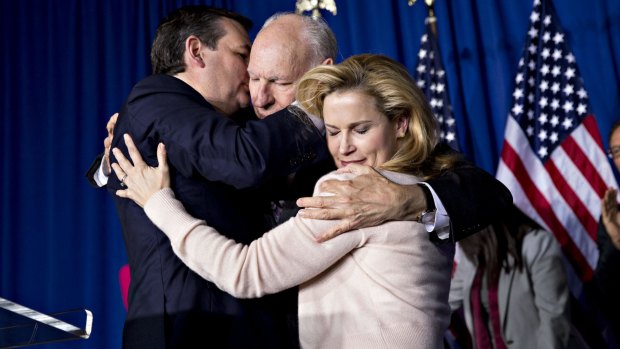 Senator Ted Cruz embraces his father, Rafael Cruz and wife Heidi Cruz after speaking at a campaign event in Indianapolis in May.