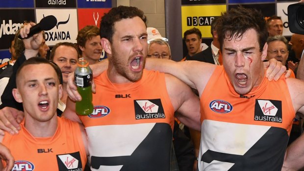 Tom Scully, Shane Mumford and Jeremy Cameron sing the song with gusto.