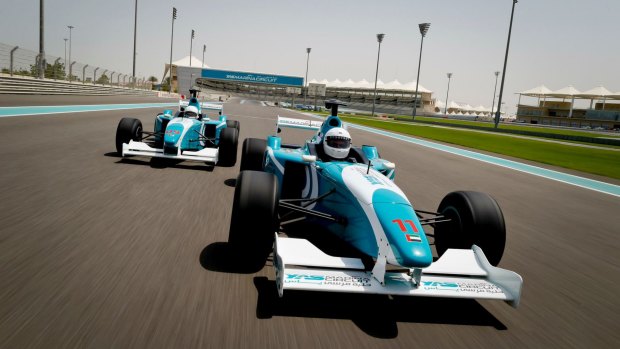 A car race in progress during the Formula Yas 3000 Driving Experience.  