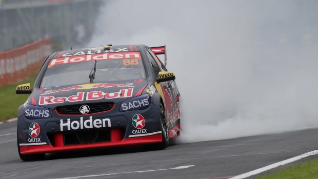 Making smoke: Jamie Whincup drives his Holden Commodore VF at Pukekohe Park Raceway.