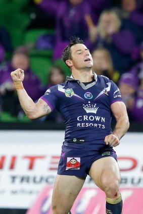 Cooper Cronk celebrates a try.