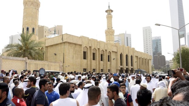 Crowds surround the Imam Sadiq Mosque after the explosion.