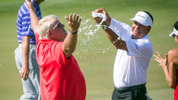 John Daly is doused with champagne after winning the Insperity Invitational golf tournament on Sunday.
