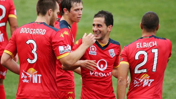 Time to celebrate: Sergio Cirio celebrates with his Adelaide teammates.