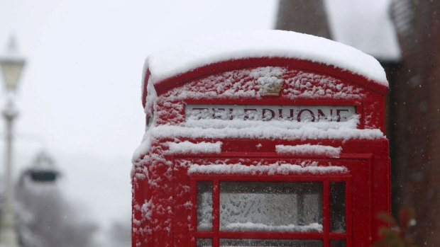 A snow covered phone box in Marlow, England, after heavy snow fell across parts of the UK.