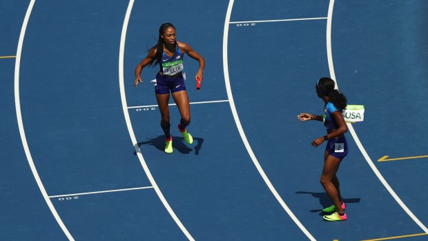 The aftermath: Allyson Felix of the United States picks up the baton and hands it to English Gardner.