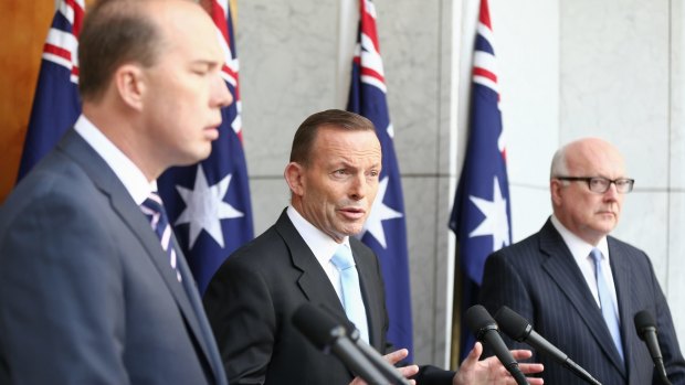 Prime Minister Tony Abbott, pictured with Peter Dutton and George Brandis, stepped up his attack on the ABC on Thursday.