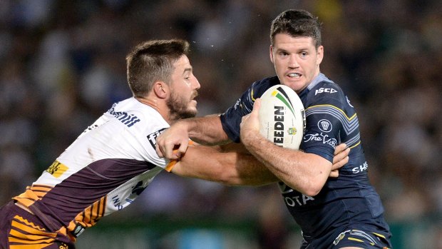 Under the microscope: Lachlan Coote (right) had a difficult night under the high ball against Brisbane.